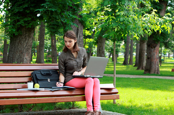 stockfresh_3459644_young-woman-studying-in-a-park_sizeS_129bc3_crop